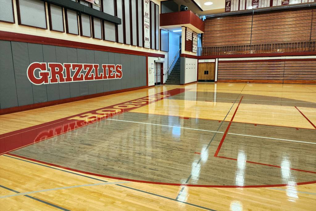 RYAN SPARKS | THE DAILY WORLD Part of the improvements to the new floor at Hoquiam Square Garden are colored 2-point areas, painted end lines and matching graphical fonts.