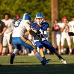 PHOTO BY FOREST WORGUM 
Elmas Colt Landstrom (9) carries the football against Rochester during the Montesano Jamboree on Aug. 30. Elma hosts Centralia in the season-opener at 7 p.m. on Friday.