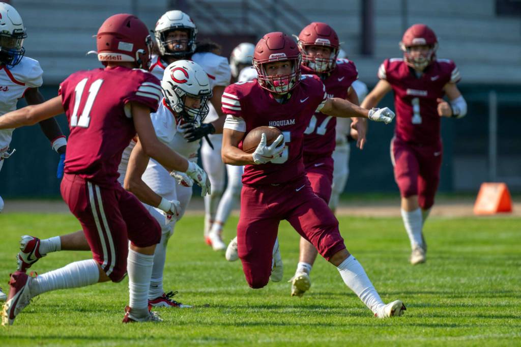 PHOTO BY FOREST WORGUM Hoquiam running back Kingston Case (middle) carries the ball during a 16-13 loss to Columbia (White Salmon) on Friday at Olympic Stadium in Hoquiam.