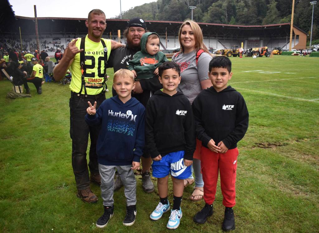 Matthew N. Wells / The Daily World
Johnny Boggs, back left, poses with his friend Erik Pink, back center, and Pinks family. Pink is holding his son Tate. Pinks girlfriend Tawnee stands to Pinks right. In front, from left, Pinks older son Ryder and his nephews Cruz and Mason stand.