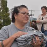 Matthew N. Wells / The Daily World
Bina Kramer handed out T-shirts to each one of the racers after the canoe races on Saturday. Bina was not only proud of her son Keson, who won, she was proud of every one else who raced on Hoquiam River.