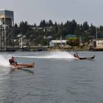 Matthew N. Wells / The Daily World
Todd Pickernell, in the canoe named Norm Sr., left, races against a competitive field that included Arlen Sansom, who is in the canoe marked Fear This. Pickernell finished in second place in the race.