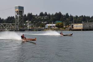 Matthew N. Wells / The Daily World
Todd Pickernell, in the canoe named Norm Sr., left, races against a competitive field that included Arlen Sansom, who is in the canoe marked Fear This. Pickernell finished in second place in the race.