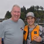 Matthew N. Wells / The Daily World
Tim Quigg, left, and Keson Kramer enjoy a moment after the canoe race on Saturday. The races, not seen on the Hoquiam River since the early 80s, returned Saturday after a fishing trip Quigg took with Kramer. And then they started talking about the canoe and everything, Bina Kramer said. And then Tims like Oh, itd be nice to get back to Loggers Playday. So (Tims) been working with my husband and my son to get this all set up again.