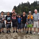 Matthew N. Wells / The Daily World
Tim Quigg, the tallest man in the photo, stands with every single racer on Saturday, plus a few, possibly future racers. Several people vocalized their gratitude for Quiggs hard work to bring the canoe races back to Hoquiam River after about 40 years of absence.