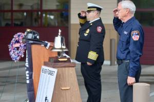 Michael S. Lockett / The Daily World
Chief Brian Ritter and Assistant Chief Mike Mandella of Ocean Shores Fire Department salute during a 9/11 ceremony.