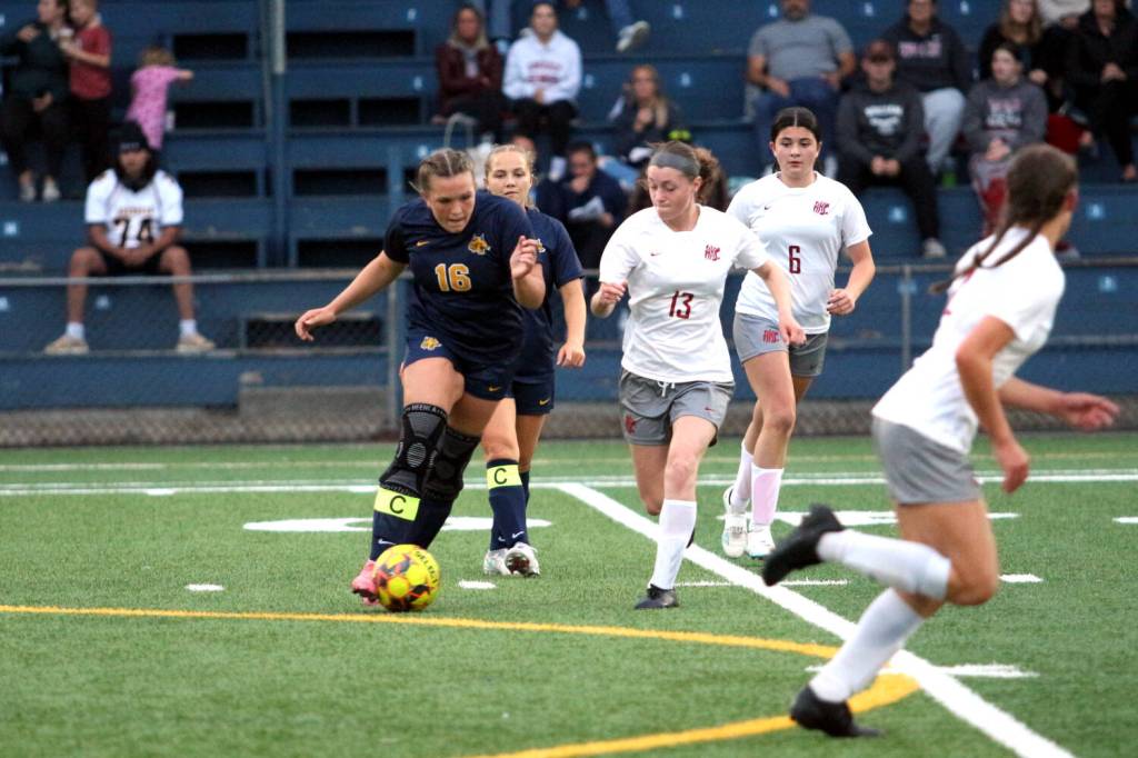 RYAN SPARKS | THE DAILY WORLD Aberdeen midfielder Delaney Shoemaker (16) dribbles against Hoquiams Addison Mathews (13) during the Bobcats 5-1 win on Thursday at Stewart Field in Aberdeen.