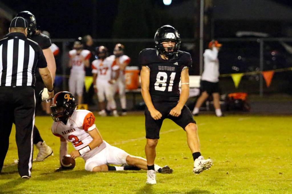 RYAN SPARKS | THE DAILY WORLD Raymond-South Bend defender Manny Becerra-Souza celebrates a sack of Rainier quarterback Jacob Meldrum (2) during the Ravens 43-34 loss on Friday in Raymond.