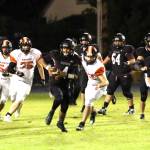 RYAN SPARKS | THE DAILY WORLD Raymond-South Bend quarterback Chris Quintana (4) breaks loose for a long run during the Ravens 43-34 loss to Rainier on Friday in Raymond.