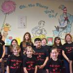 Matthew N. Wells / The Daily World
Ezri Carroll, an Aberdeen High School student, and the 10-student team from McDermoth Elementary School, proudly help unveil part of the newest artwork inside McDermoths library.