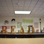 Ezri Carrolls Aberdeen High School senior project  artwork showing literary characters across multiple generations inside McDermoth Elementary School  lays out a simple message for her intended target audience: READ. The hope is the excitement the young students who toured the library with the new artwork keeps up for years to come. (Matthew N. Wells / The Daily World)