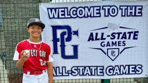 Brittany Mondor
Gunner Mondor, an 11-year-old from Ocean Shores, holds up the home run ball he hit at the Perfect Game All State Games last month.