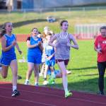 PHOTO BY LUCY SCOTT Elmas Destiny Whipple (left) and Montesanos Alice Nelson race to the finish at a 1A Evergreen League cross-country meet on Thursday at Hoquiam High School.
