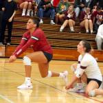 RYAN SPARKS | THE DAILY WORLD Hoquiams Aaliyah Kennedy (left) digs the ball while flanked by libero Lexi LaBounty during the Grizzlies 3-0 win over Aberdeen on Thursday in Hoquiam.
