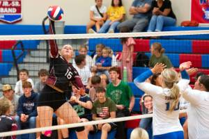 PHOTO BY VAN ADAM DAVIS Ocosta middle blocker Anna Davis (left) rises for a kill during a five-set victory over Willapa Valley on Tuesday in Menlo.