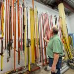 Michael S. Lockett / The Daily World
Grays Harbor PUD Operations Director Matt Rolow looks at the collection of hot sticks in the utilitys possession.