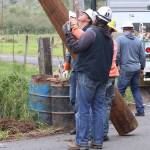 Michael S. Lockett / The Daily World
Line crews for Grays Harbor PUD guide a replacement pole into position.