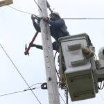 Michael S. Lockett / The Daily World
A Grays Harbor PUD line crew works to replace an old pole.