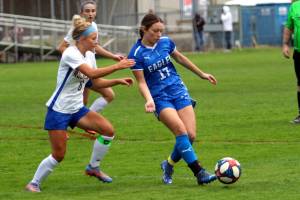 RYAN SPARKS | THE DAILY WORLD Elma midfielder Aubree Simmons (17) passes the ball while defended by Rochesters Emily Beasley during a 4-0 victory on Thursday at Elma High School.