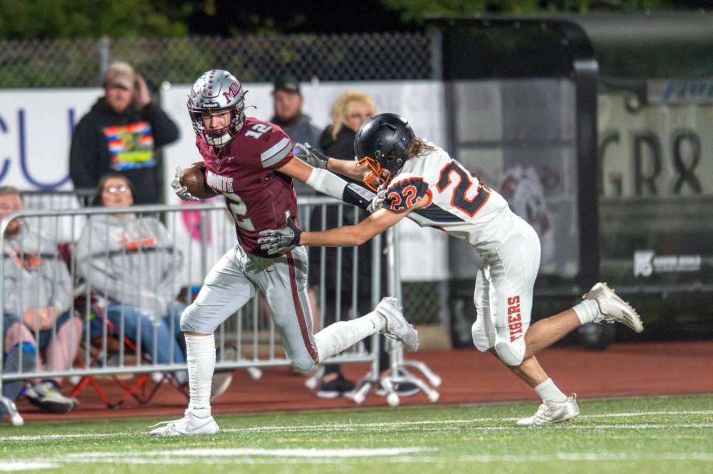 PHOTO BY FOREST WORGUM Montesano junior receiver Toren Crites (12) pulls away from Napavine defender Jayson Hull en route to scoring a touchdown during a 35-19 win on Friday at Jack Rottle Field in Montesano.
