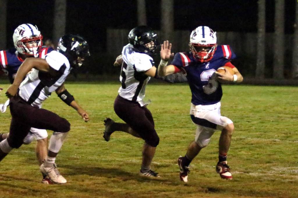 RYAN SPARKS | THE DAILY WORLD PWV running back Blaine King (3) avoids the tackle of RSB defender Isaac Schlueter (15) en route to a 72-yard touchdown run during a 53-14 win on Friday at Crogstad Field in Menlo.