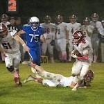 PHOTO BY PATTI REYNVAAN 
Hoquiam running back Kingston Case (5) looks for running room during a 14-13 win over Toutle Lake on Friday at Toutle Lake High School.