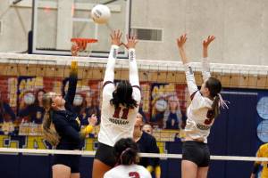 RYAN SPARKS | THE DAILY WORLD Aberdeens Morgan McCombs (5) puts up a shot over Hoquiams Aaliyah Kennedy (11) and Hayden Brook-Andrew during the Bobcats 3-0 win on Monday at Aberdeen High School.