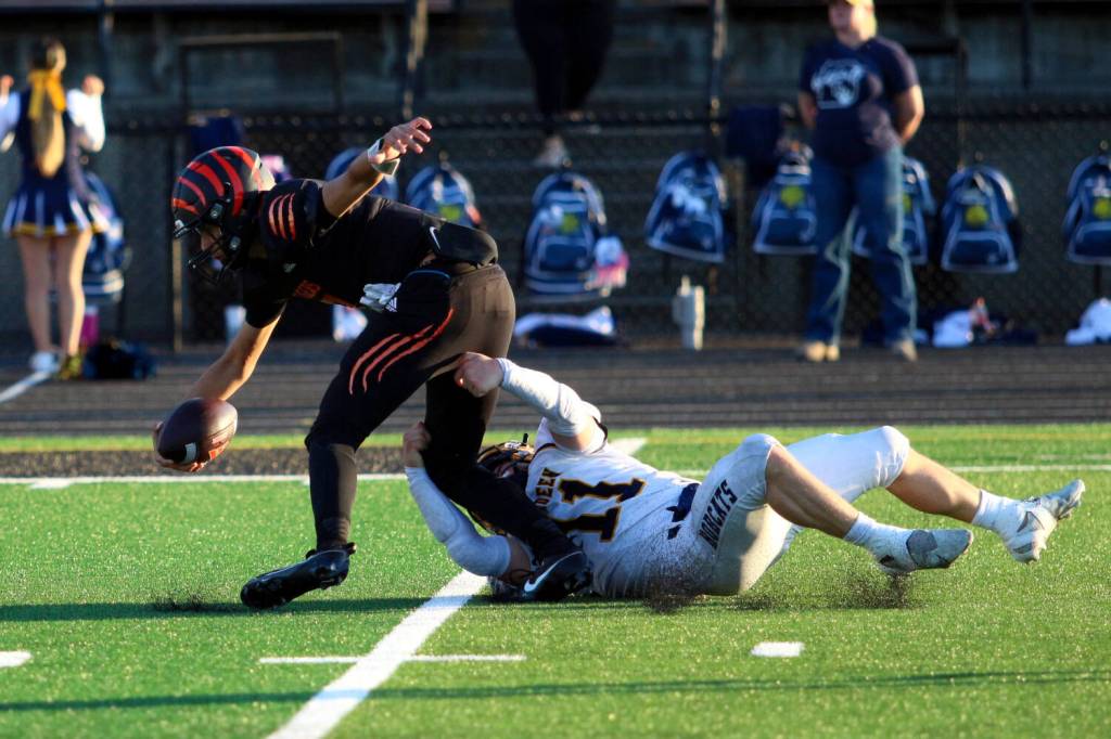 RYAN SPARKS | THE DAILY WORLD Aberdeen linebacker Riley Wixson (11) tackles a Centralia player in the backfield during a 40-0 victory over Centralia on Saturday in Centralia.