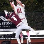 RYAN SPARKS | THE DAILY WORLD Hoquiam tight end Lincoln Niemi (81) leaps over Montesano defensive back Zach Timmons to make a catch during the first half of Montes 42-0 victory on Friday at Montesano High School.