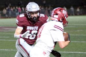 RYAN SPARKS | THE DAILY WORLD Montesanos Mason Rasmussen (48) pursues Hoquiams Lincoln Niemi after Niemi recovered a fumble during the Bulldogs 42-0 win on Friday in Montesano.