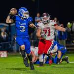 PHOTO BY FOREST WORGUM Elma quarterback Isaac McGaffey (3) looks to throw while pursued by Tenino defensive lineman Rowdie Tafoya in the Eagles 27-16 victory on Friday at Davis Field in Elma.