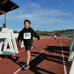 SUBMITTED PHOTO Central Park Elementary Schools Travis McGowan crosses the finish line at the Aberdeen Youth Fun Run on Sunday in Aberdeen.