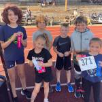 SUBMITTED PHOTO The Aberdeen Youth Fun Run 1-mile winners pose for a photo on Sunday at the Miller Junior High School track. Pictured are (front row, from left) Brynlee Burgher, Eastyn Vines. Back row: Gemma Courts, Robbie Cech, Brody Hatton and Alex Steele.