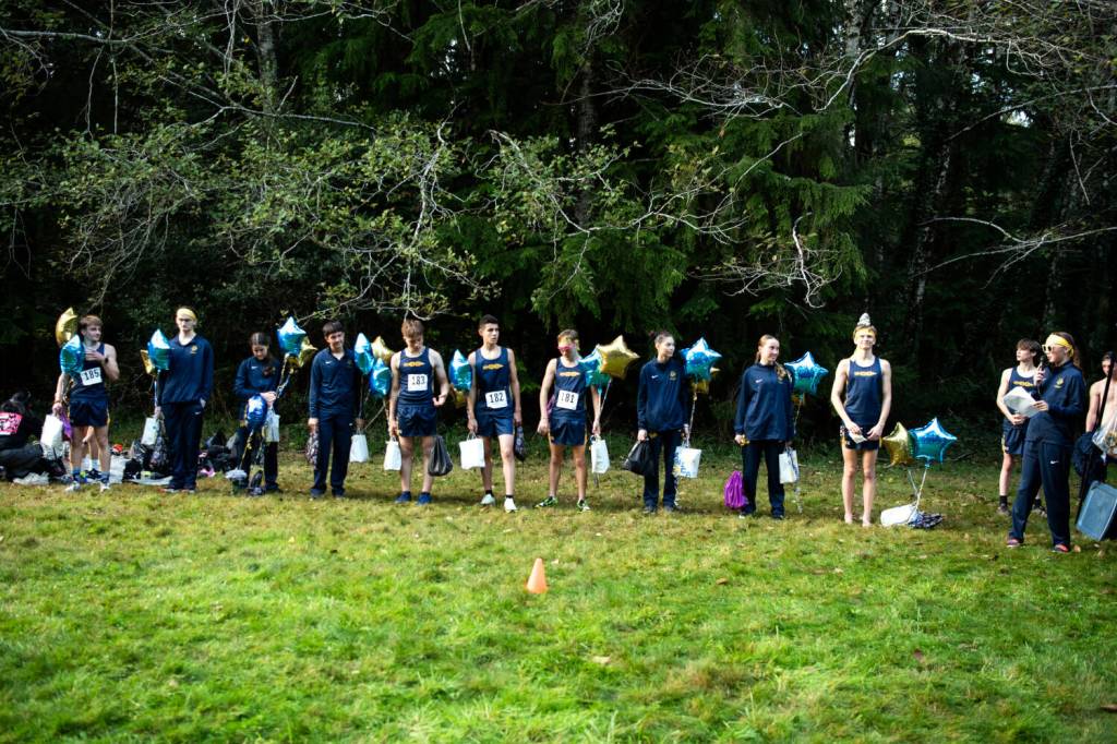 PHOTO BY ALICIA TISDALE Aberdeens cross country team honored its seniors during a meet on Wednesday, Oct. 9 at Makarenko Park in Cosmopolis. Pictured are (from left) Henry Nelson, Micheal Flanigan, Ines Horcajada, Marc Avila, Michael Hatton, Jacob Hallak, Kyler Haggard, Anica Reimer, Aitana de Vente Boix and William Sharp.