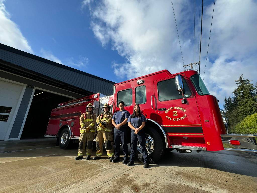 Michael S. Lockett / The Daily World
Grays Harbor Fire District 2 firefighters pose with their departments new engine.