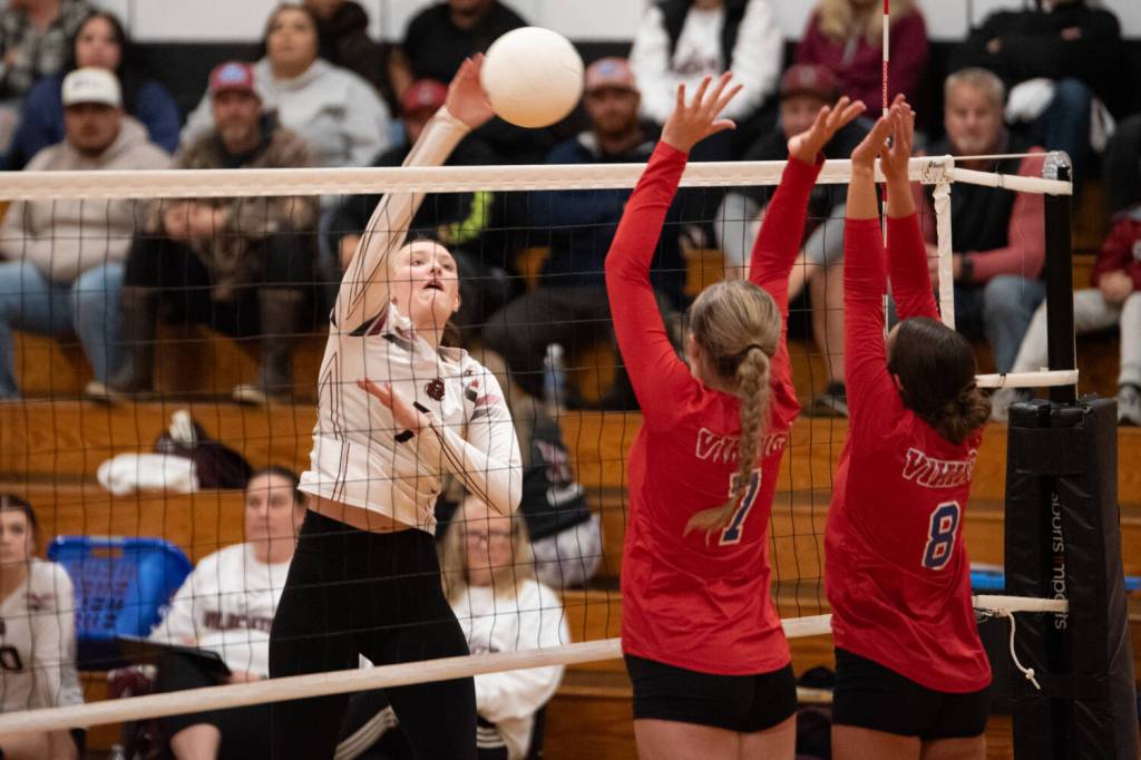 PHOTO BY VAN ADAM DAVIS Ocosta hitter Jolissa Schlegel (left) shoots against Willapa Valley defenders Tylar Keeton (7) and Rilyn Channell during the Wildcats 3-1 win on Thursday at Ocosta High School.