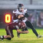 PHOTO BY FOREST WORGUM Hoquiams Kingston Case (5) tackles Tenino fullback Parker Minerich during a 36-7 loss on Friday at Olympic Stadium in Hoquiam.