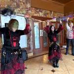 Matthew N. Wells / The Daily World
Three witches, Julie Swor, Laurie Butcher and Deb Blecha dance during Walk of the Undead on Saturday in front of the D&R Theatre. Joined by Gwyn Tarrence, not pictured, they provided a fun yet spooky performance that several people applauded.
