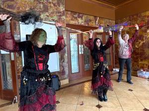 Matthew N. Wells / The Daily World
Three witches, Julie Swor, Laurie Butcher and Deb Blecha dance during Walk of the Undead on Saturday in front of the D&R Theatre. Joined by Gwyn Tarrence, not pictured, they provided a fun yet spooky performance that several people applauded.