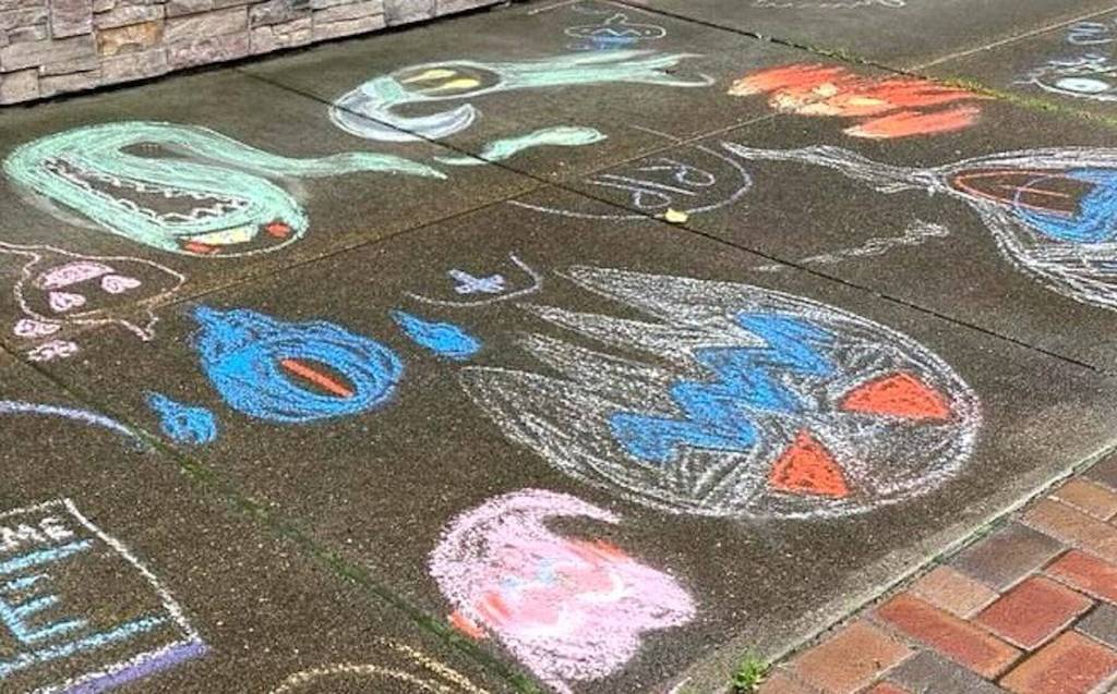 Doug Orr
On Saturday, during the Walk of the Undead Chalk Contest, Ellery Einander and Simon Jeffery won in the Youth category with their creative work.