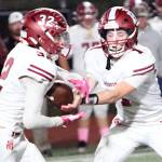 DAILY WORLD FILE PHOTO 
Hoquiam quarterback Joey Bozich (1) hands the ball off to running back Winston Kaikaka during a game on Oct. 11. Hoquiam faces Elma on Friday at Olympic Stadium in Hoquiam.