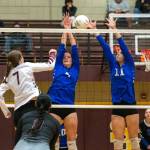 PHOTO BY FOREST WORGUM Raymond-South Bends Macey Enlow (7) get the ball through Elma defenders Addi Witt and Nani Kanios (11) during the Ravens straight-set victory on Monday at South Bend High School.