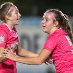 PHOTO BY ASHER HOLCOMB Montesanos Lainey Robinson (left) and Sam Roundtree celebrate a goal during a 4-0 victory over Rochester on Tuesday at Montesano High School.