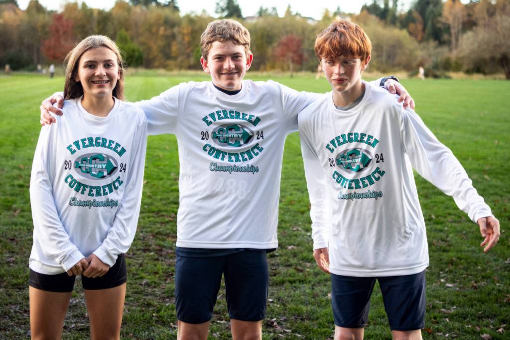 ALICIA TISDALE | ALICIATISDALE.COM Miller Junior High School runners (from left) Adalyn Friberg, Oliver Cech and Trenton George pose for a photo after earning all-league honors at the 2A Evergreen Conference Championships on Wednesday in Tumwater.