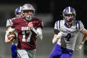 PHOTO BY FOREST WORGUM Montesano running back Terek Gunter (17) runs away from Nooksack Valleys Cole Bauman during a 34-28 win on Friday at Jack Rottle Field in Montesano.