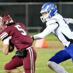 RYAN SPARKS | THE DAILY WORLD Hoquiams Kingston Case (5) races away from Elmas Isaac McGaffey during the Eagles 36-14 win on Friday at Olympic Stadium in Hoquiam.