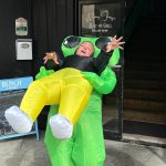 Jessica Knutson, owner of Messy Jessy's Bar and Grill, dresses as "Hammerhead," an alien who's dragging away a human being victim. Knutson loves dressing up for Halloween and she loves seeing all the children as they come down in fun and scary costumes. (Matthew N. Wells / The Daily World)
