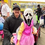 Rory Nguyen and his daughter Paisley walk around Downtown Aberdeen in search of candy and fun. Paisley was dressed in both "Ghost Face" from the Scream movies and a character from Paw Patrol. (Matthew N. Wells / The Daily World)