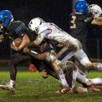 KODY CHRISTEN | THE CHRONICLE Adnas Luke Mohney (left) is tackled by Pe Ell-Willapa Valleys Cody Mican (10) during the Titans 14-0 loss on Thursday in Adna.