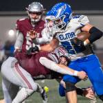 PHOTO BY FOREST WORGUM Montesano linebacker Felix Romero (left) tackles Elma running back Bo Muller during the Bulldogs 45-0 win on Friday in Montesano.